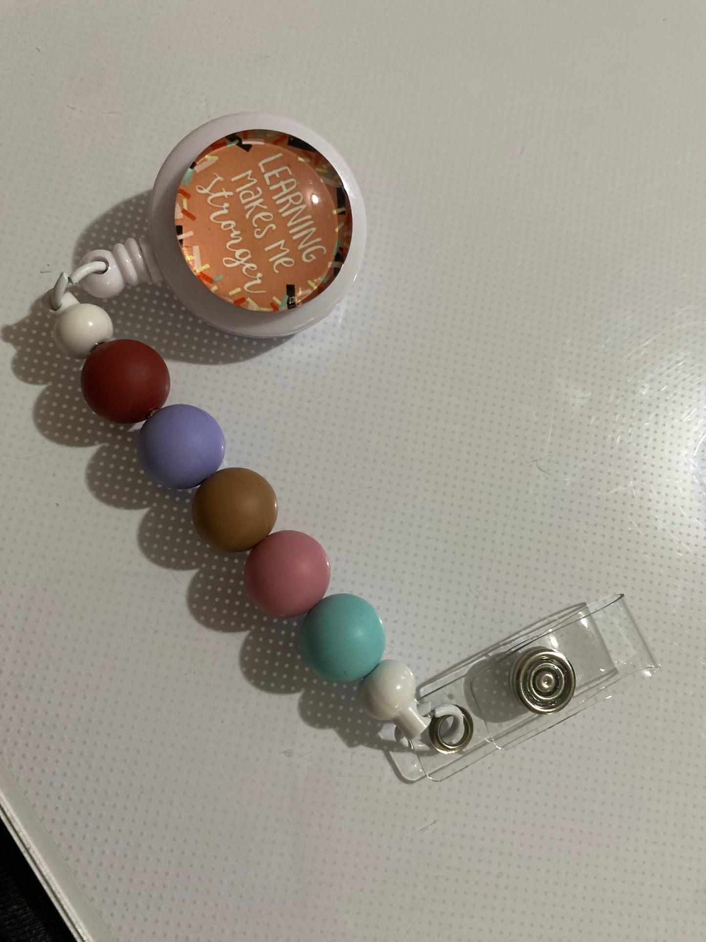 “Learning Makes Me Stronger” badge reel holder