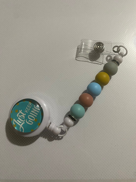 “Just Keep Going” badge reel holder