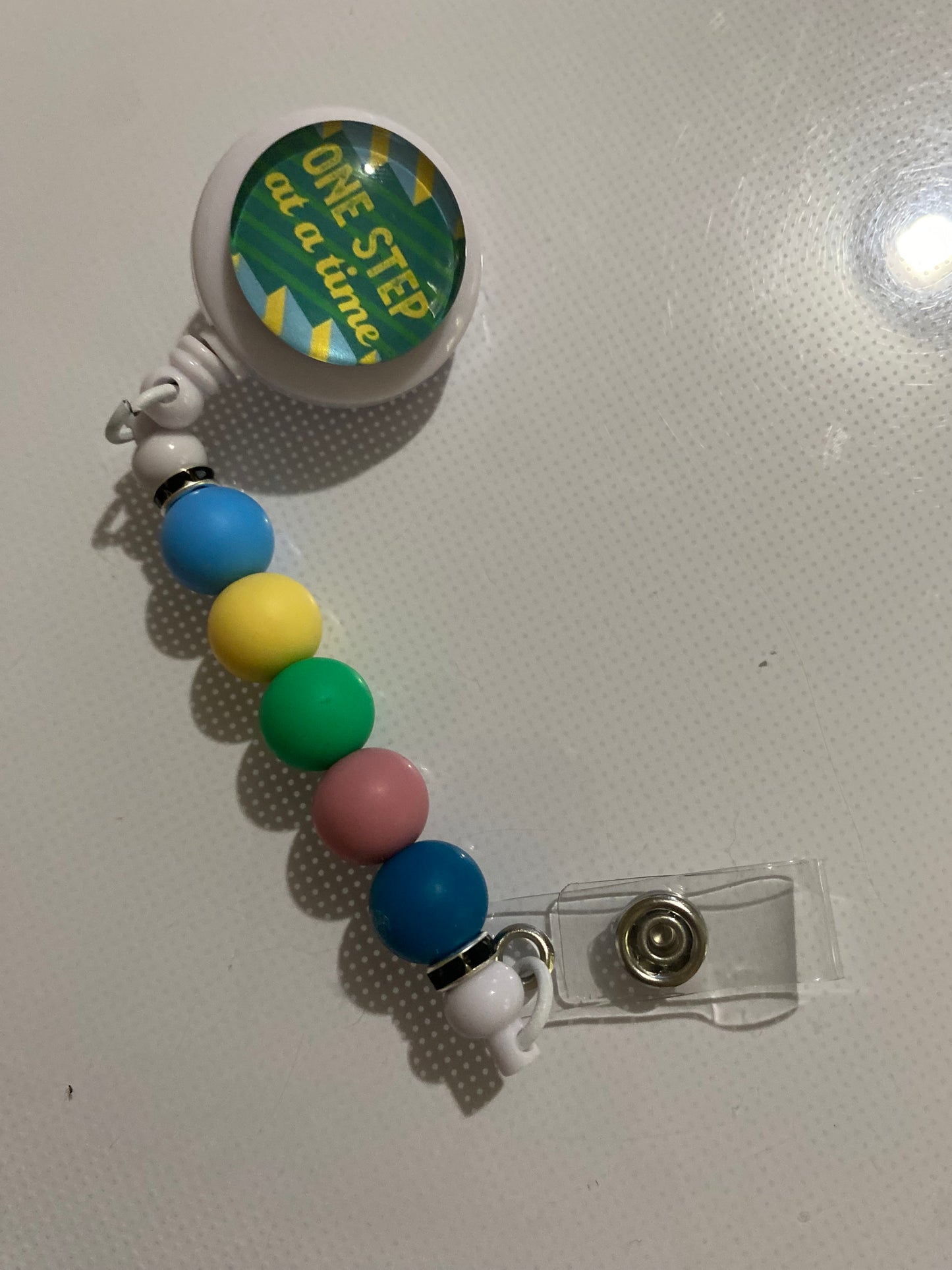 “One Step at a Time” badge reel holder