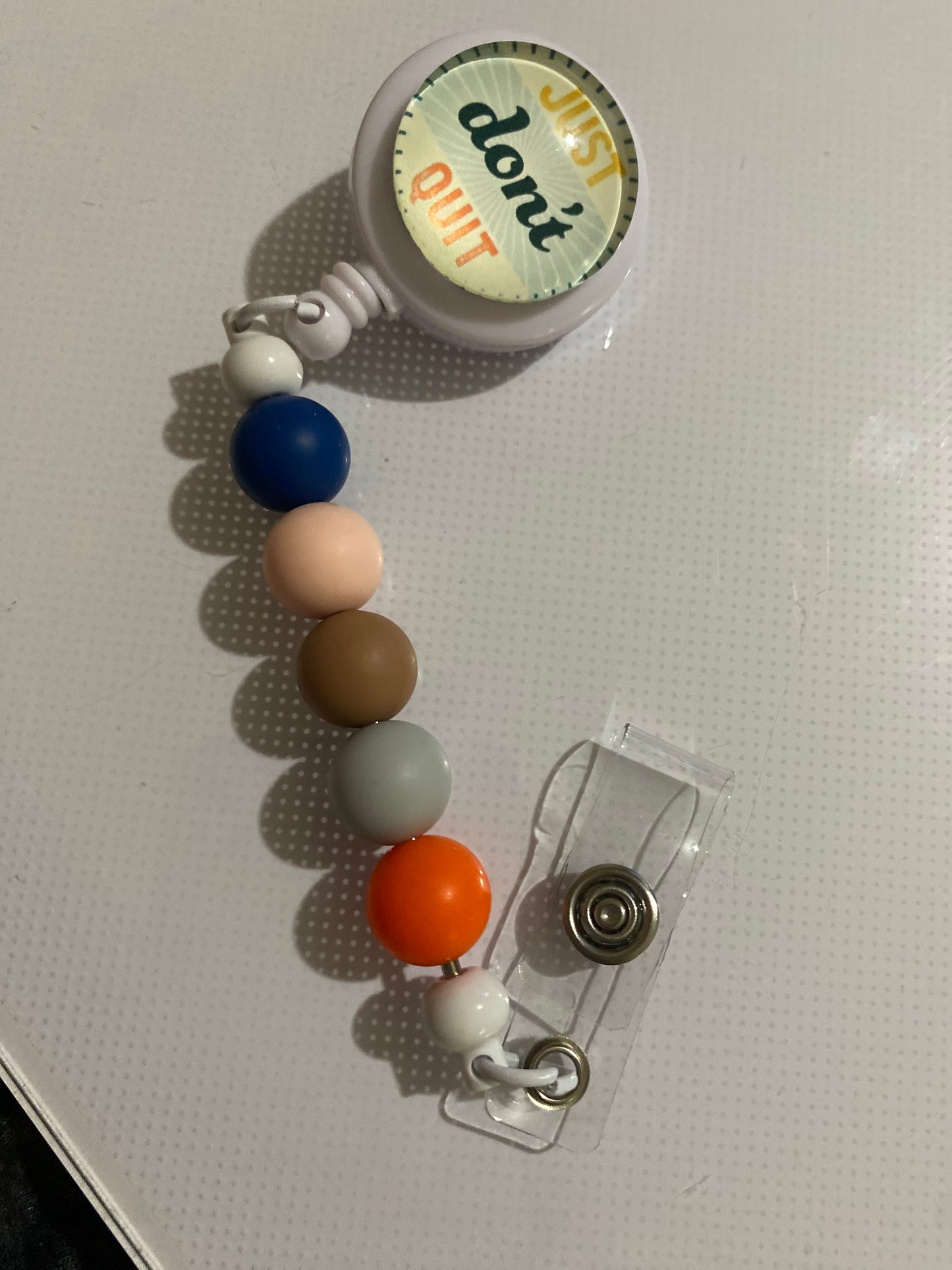 “Just Don’t Quit” badge reel holder