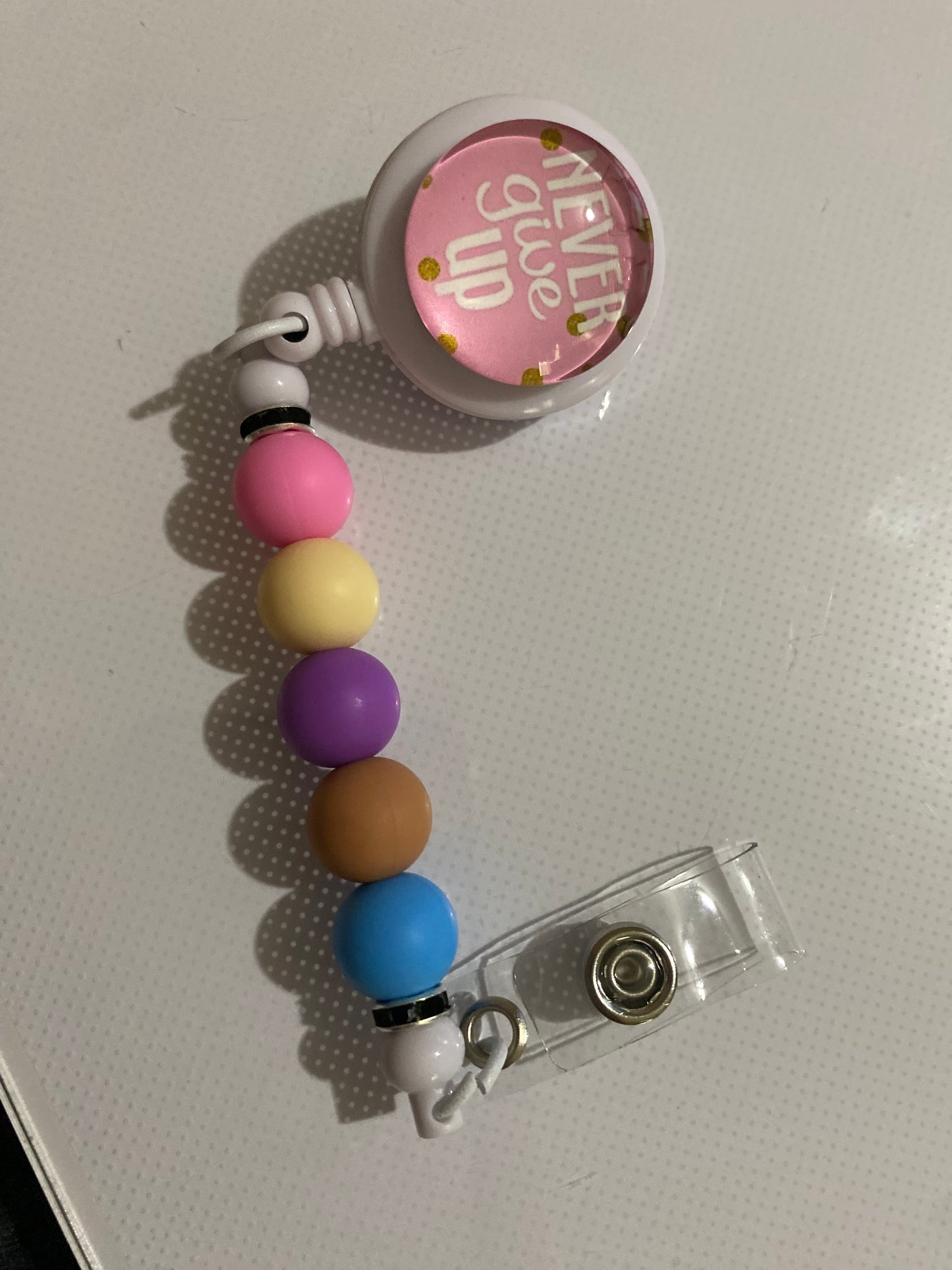 “Never Give Up” badge reel holder - 2