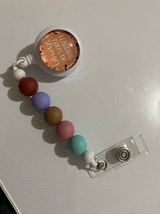 “Learning Makes Me Stronger” badge reel holder