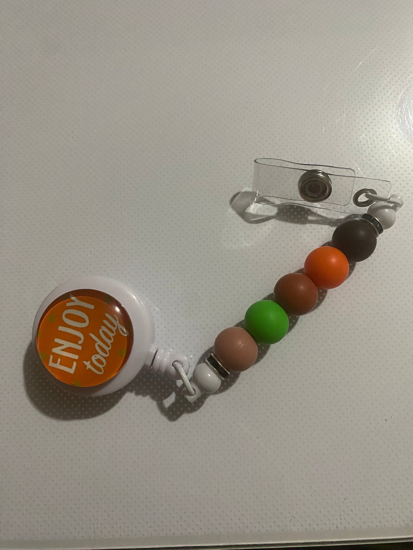 “Enjoy Today” badge reel holder