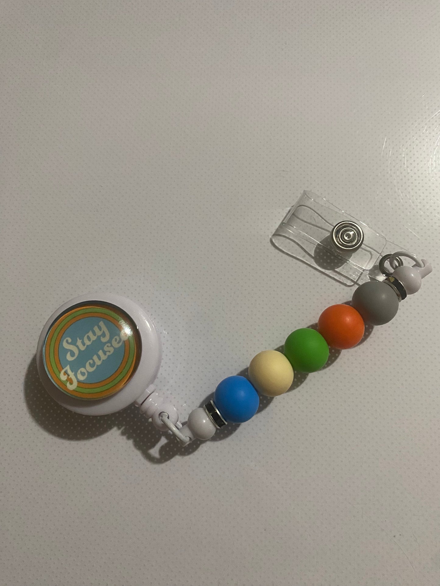 “Stay Focused” badge reel holder
