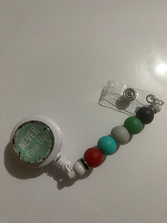 “Never Give Up” badge reel holder - 1