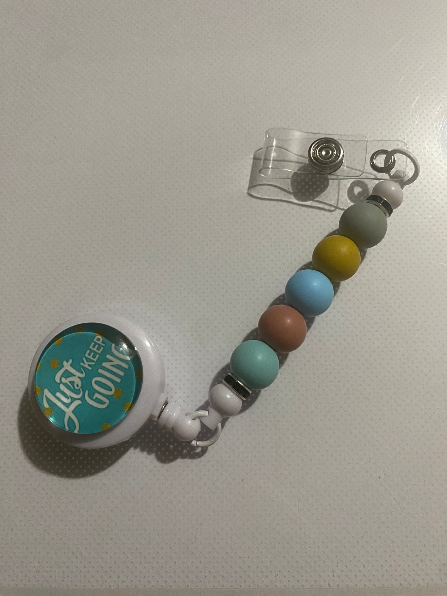 “Just Keep Going” badge reel holder